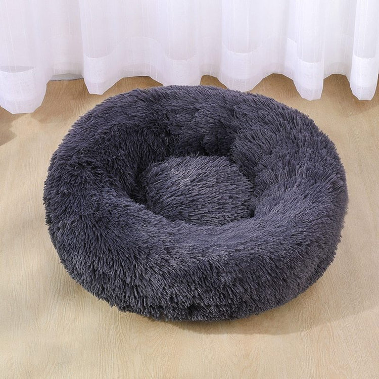 a grey furry dog bed