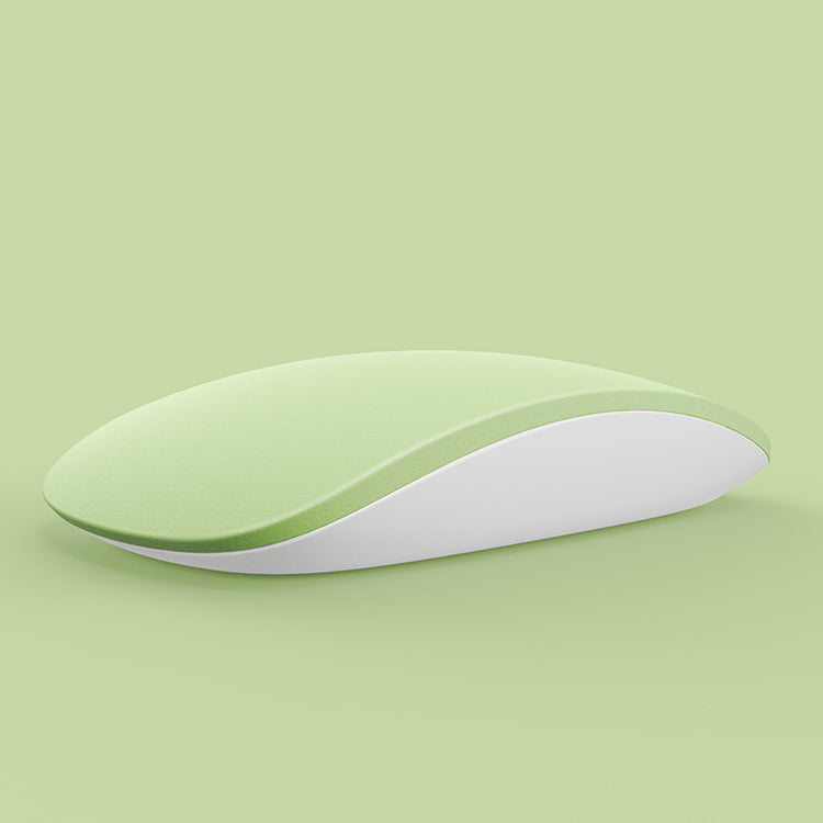 a computer mouse on a green background