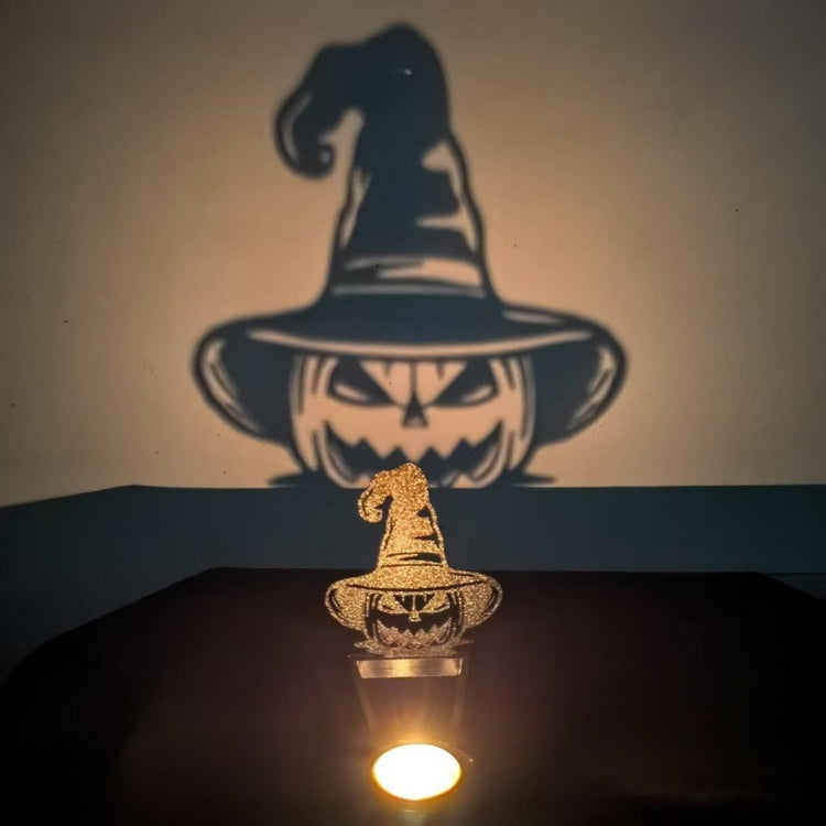 a pumpkin and a candle on a table