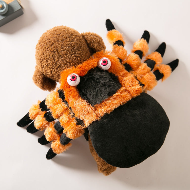 a stuffed animal with a spider garment