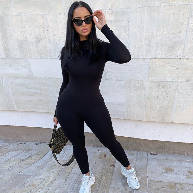 a woman in a black jumpsuit