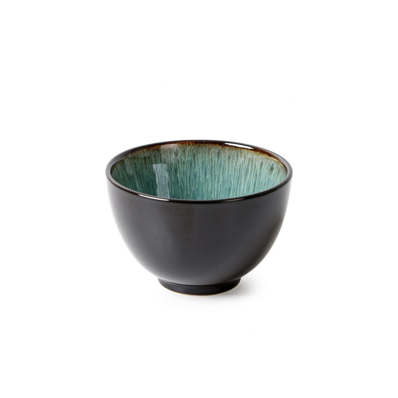 a black bowl with blue speckled rim
