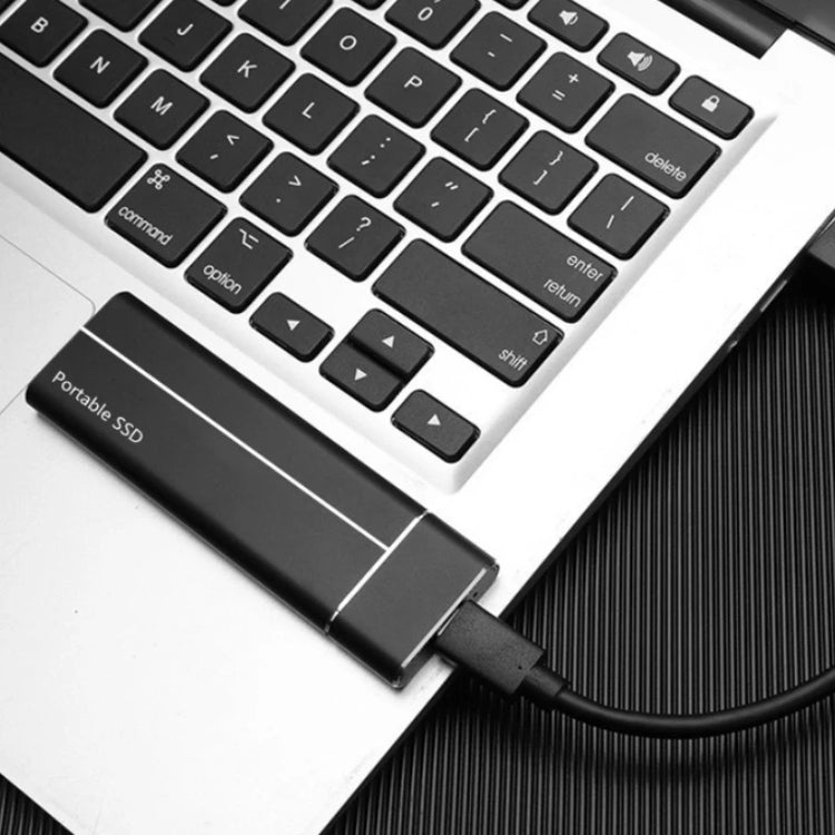 a laptop with a usb cable