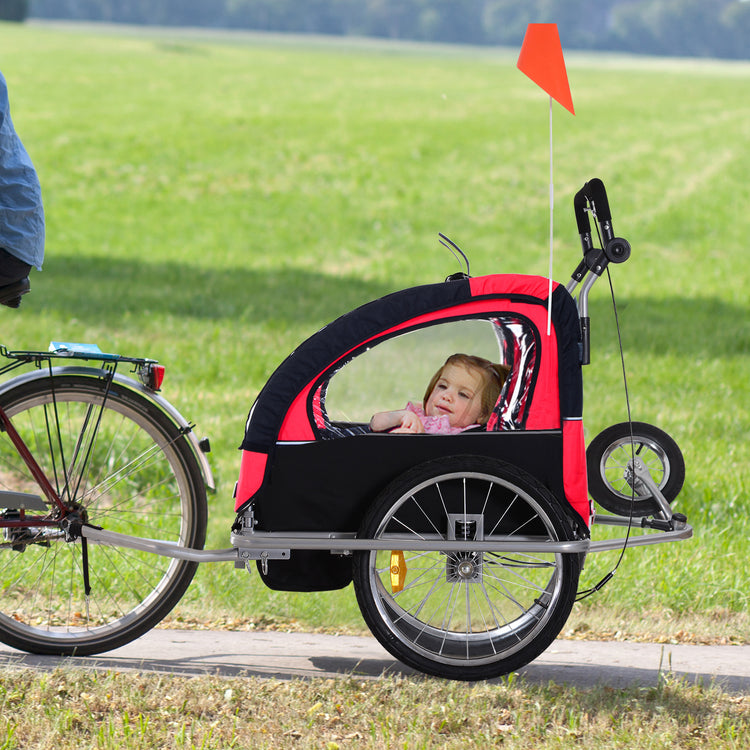 a child in a bicycle trailer