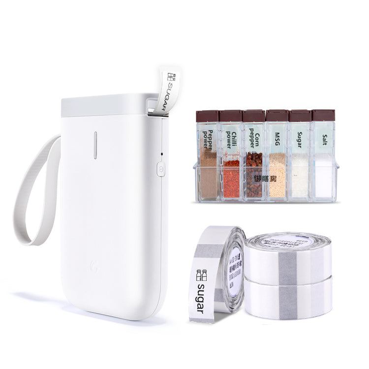 a white device with tape and tape in a container