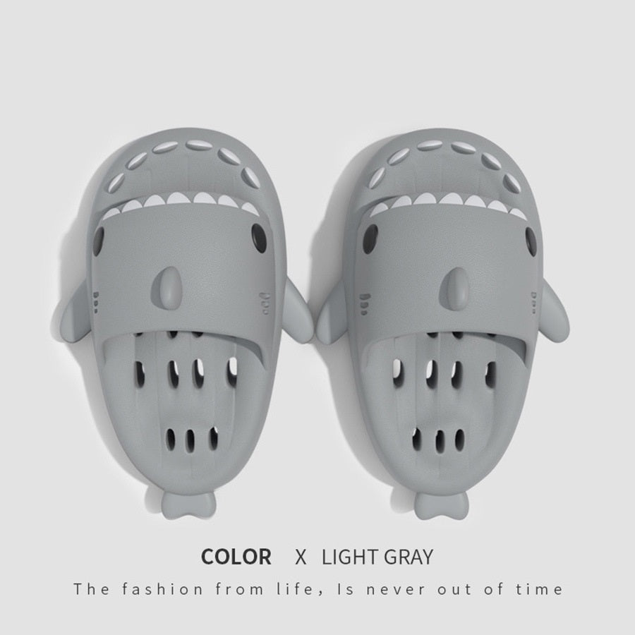 a pair of grey slippers