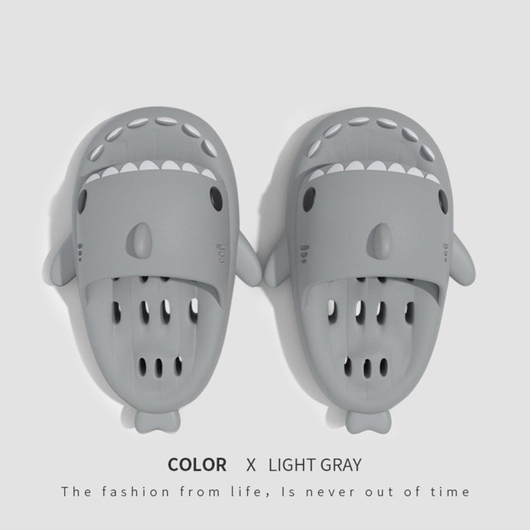 a pair of grey slippers