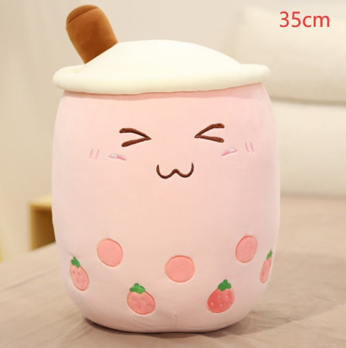 a pink and white stuffed animal