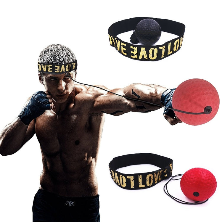 a man with boxing gloves and a red ball