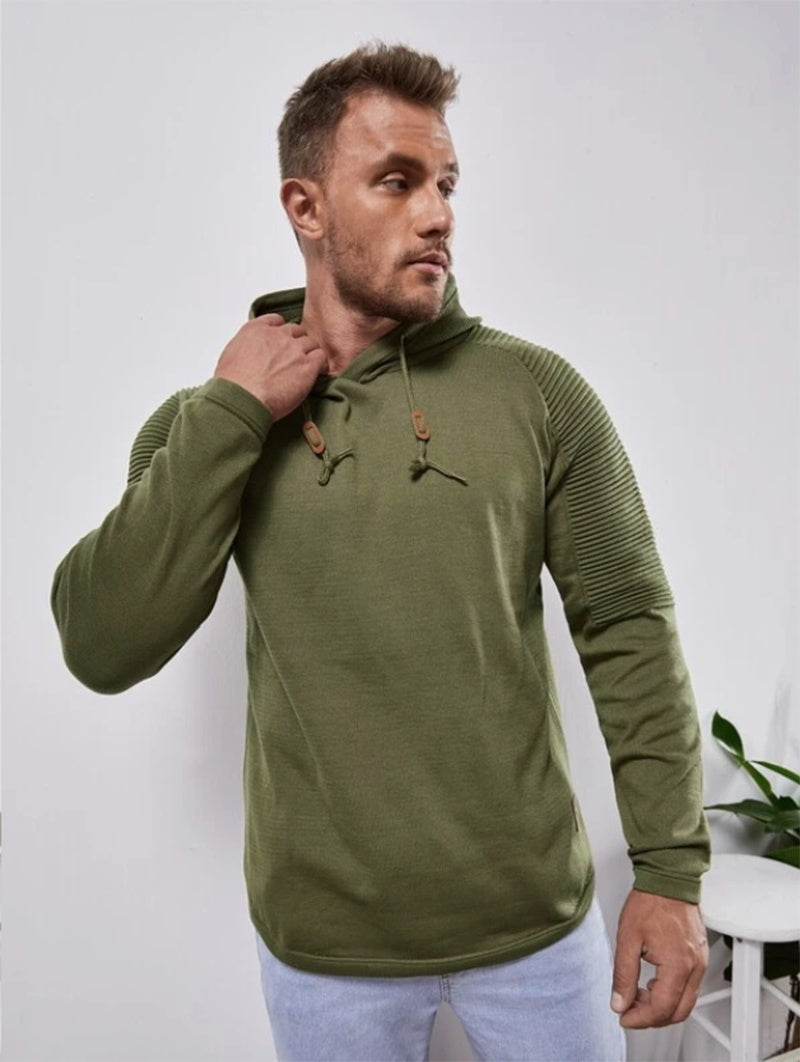 a man in a green sweatshirt