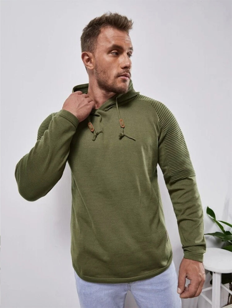 a man in a green sweatshirt