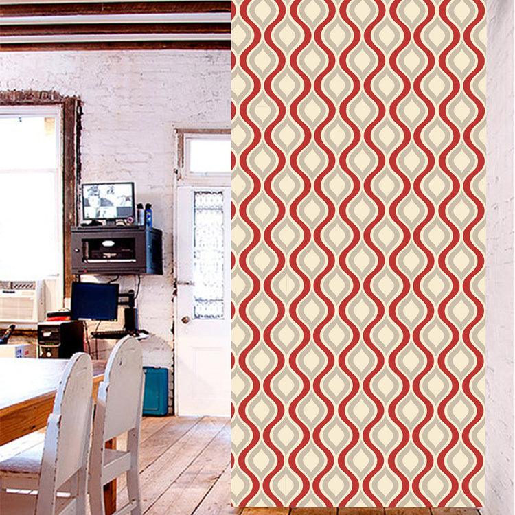 a room with a table and a wall with a pattern