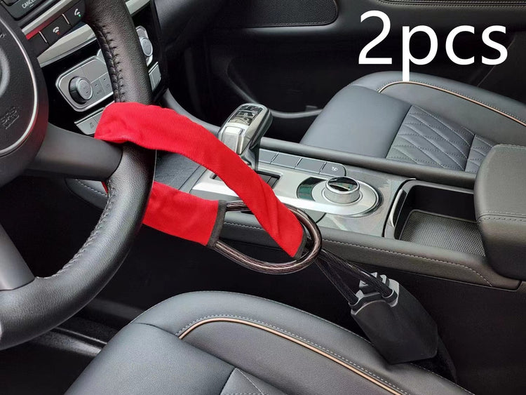 a red strap on a steering wheel