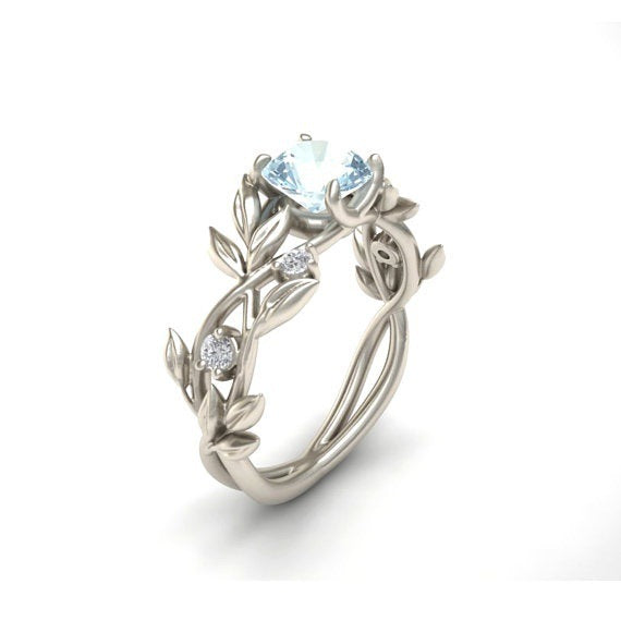 a silver ring with a diamond