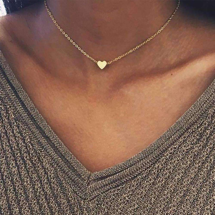 a person wearing a gold necklace