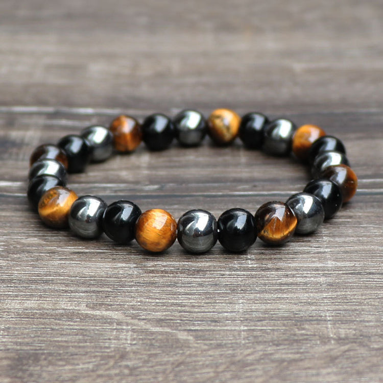 a bracelet on a wood surface