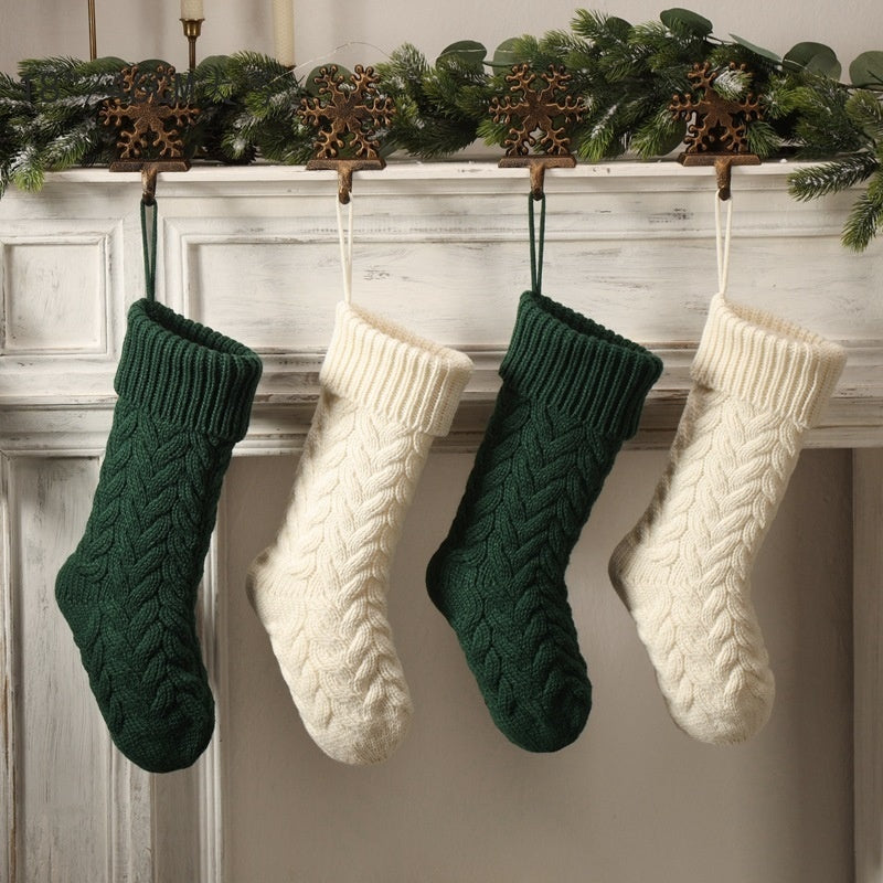 a group of knitted socks from a fireplace