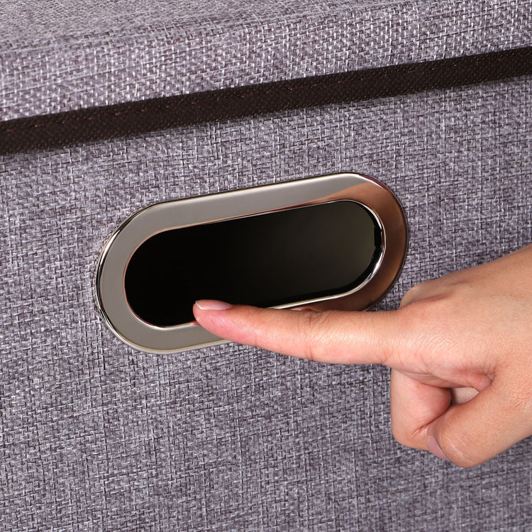 a finger pointing at a button