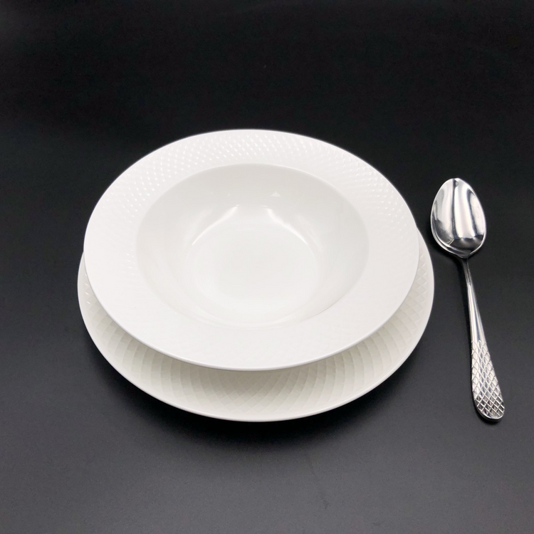 a white plate and spoon