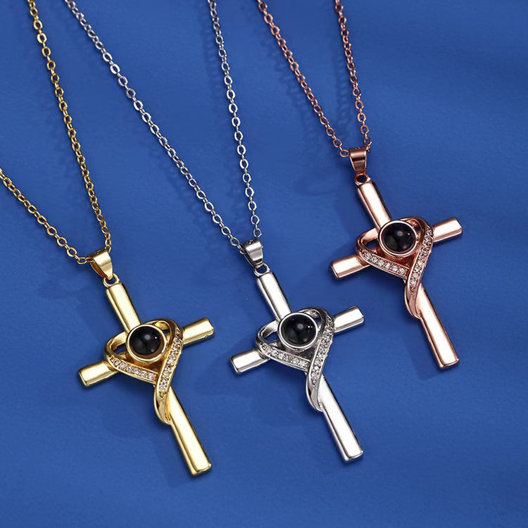 a group of gold and silver cross necklaces
