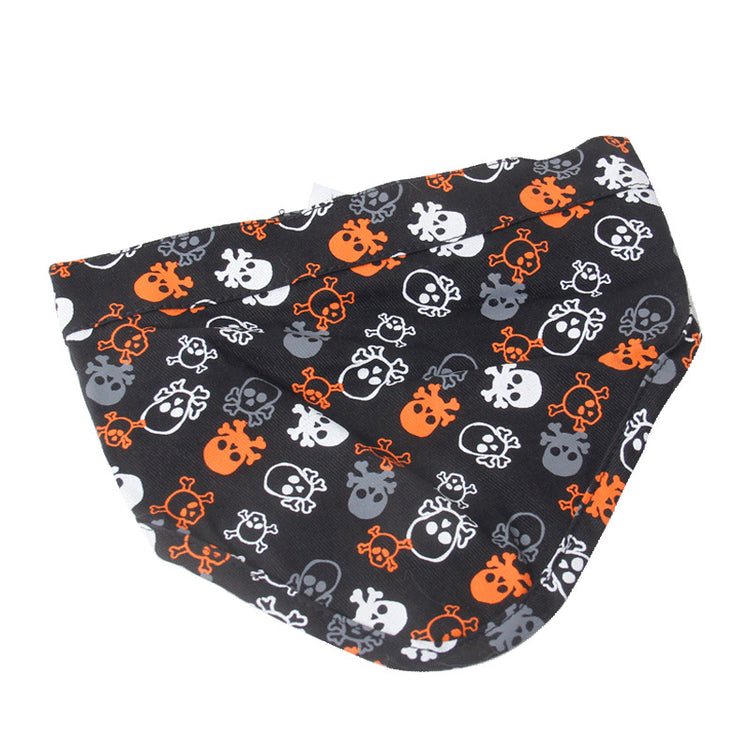 a black and orange bandana with skulls on it