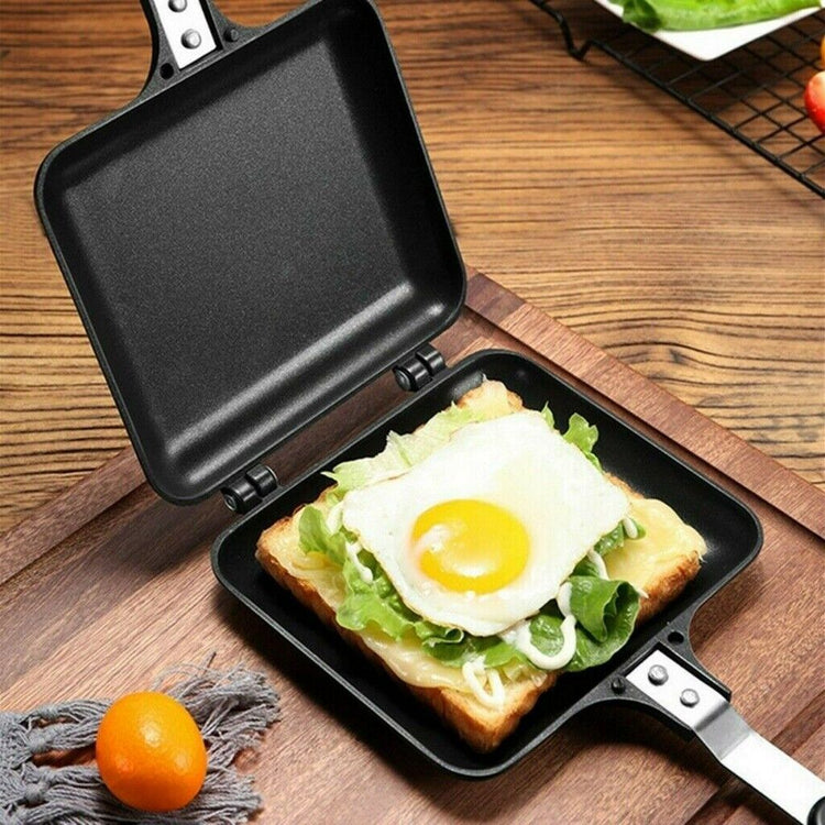 a pan with a fried egg on top of a toasted bread