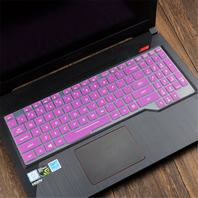 a laptop with purple keyboard