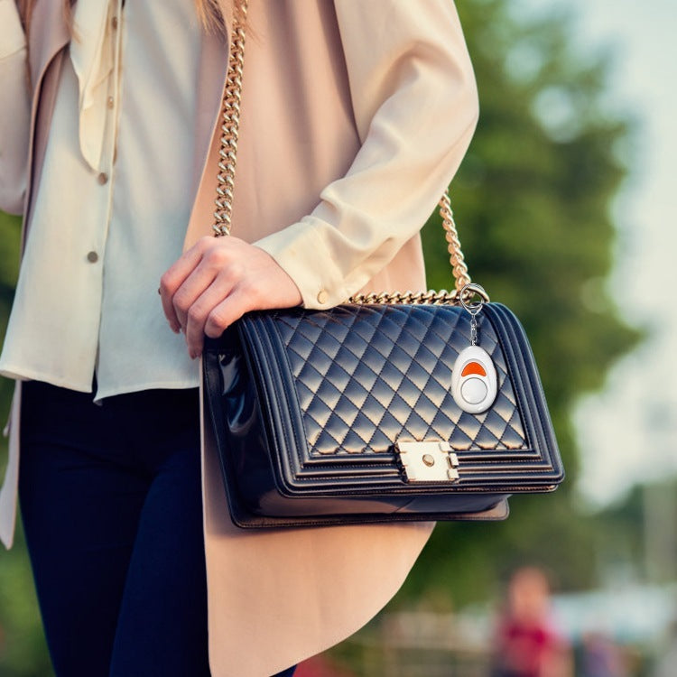 a woman holding a black purse