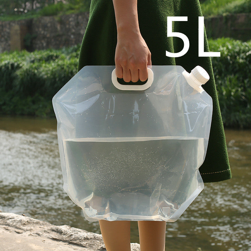 a person holding a plastic bag with water in it