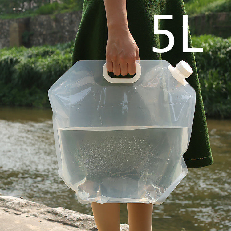 a person holding a plastic bag with water in it