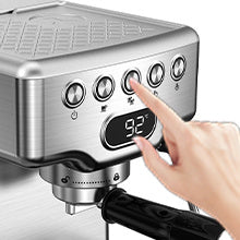 a finger pressing a button on a machine