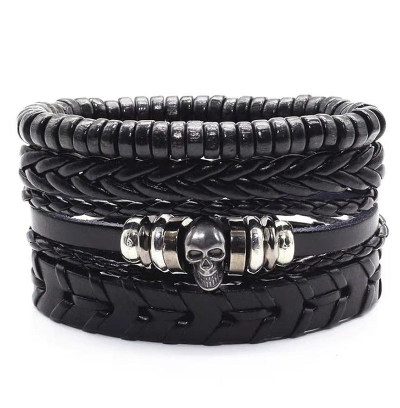 a black leather bracelet with a skull on it