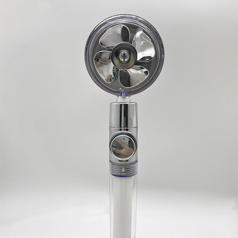 a silver fan with a round circular design