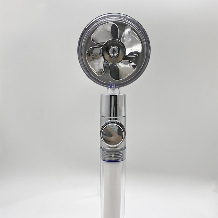 a silver fan with a round circular design