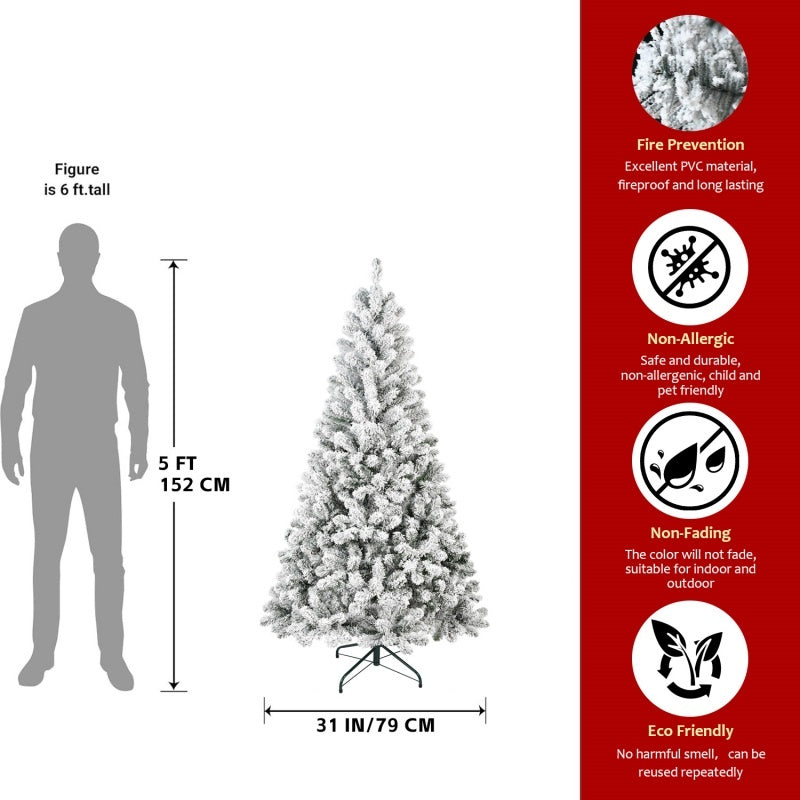 a man standing next to a christmas tree
