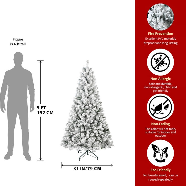 a man standing next to a christmas tree