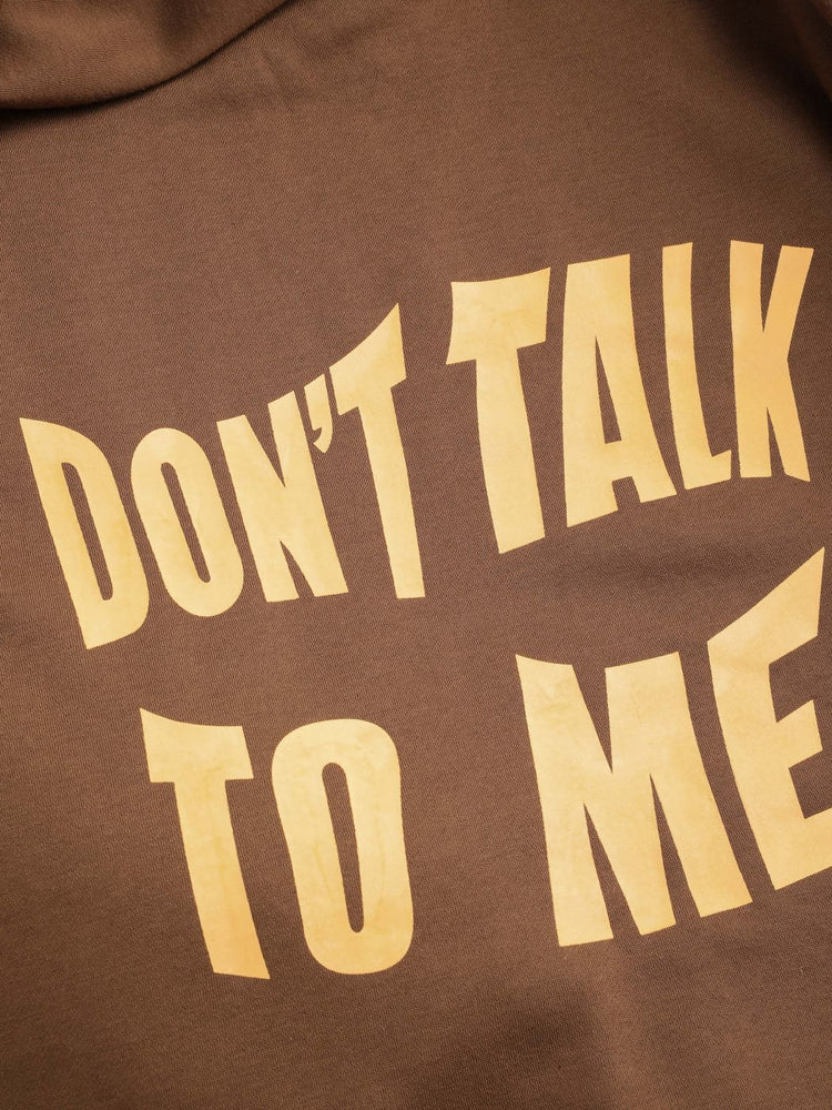 a brown fabric with white text