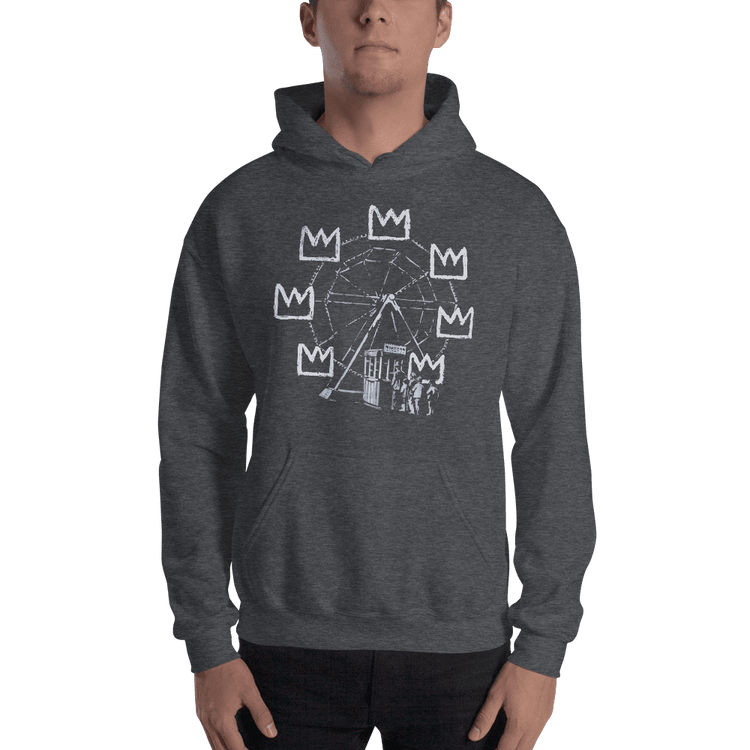 a man wearing a grey sweatshirt with a picture on it