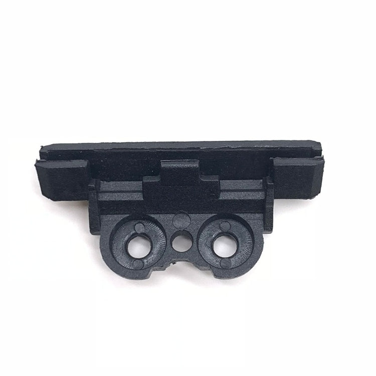 a black plastic object with two holes