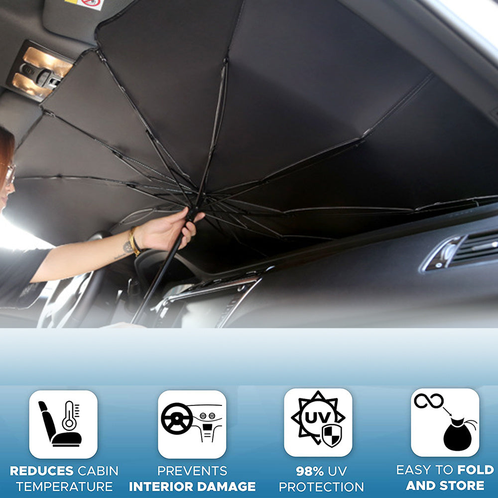 a woman holding an umbrella in a car