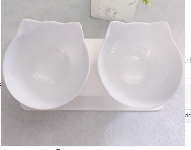 a cat shaped bowls on a stand
