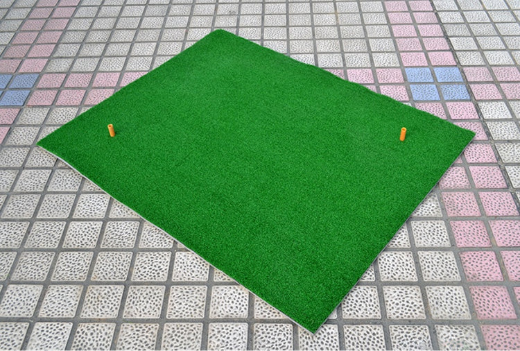 a green mat with orange golf pins on it