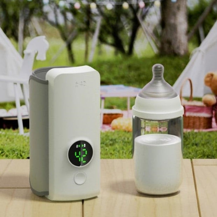 a baby bottle and a device on a table