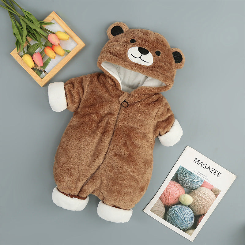 a teddy bear garment with a book and flowers