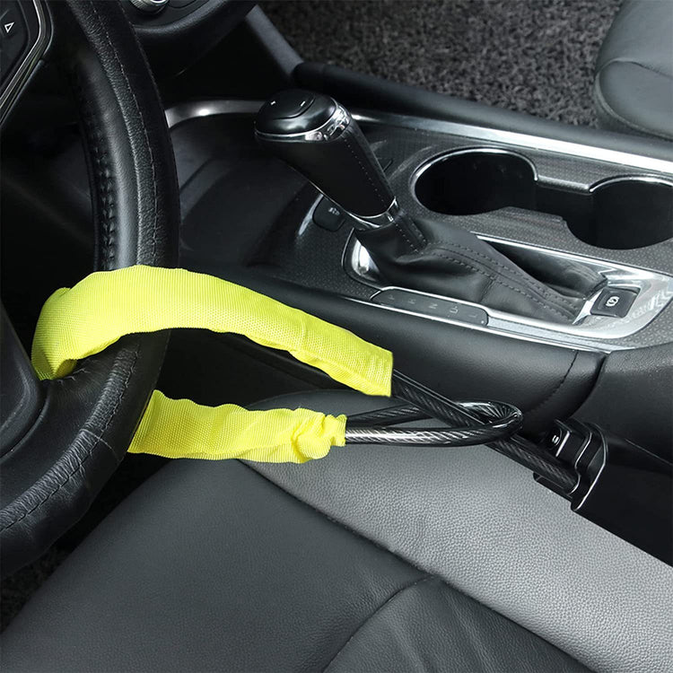 a yellow strap attached to a steering wheel