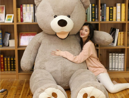 a woman hugging a large teddy bear
