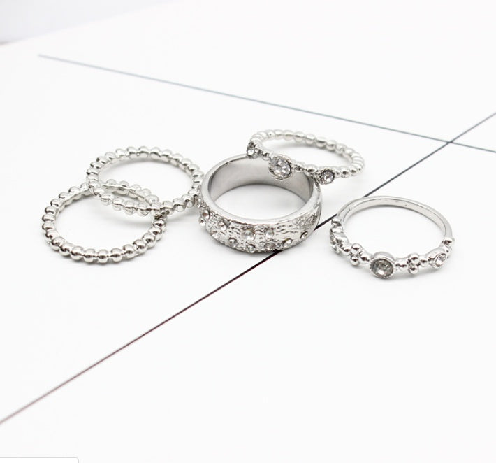 a group of rings on a white surface