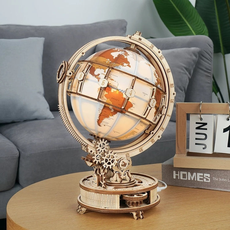 a wooden globe on a table