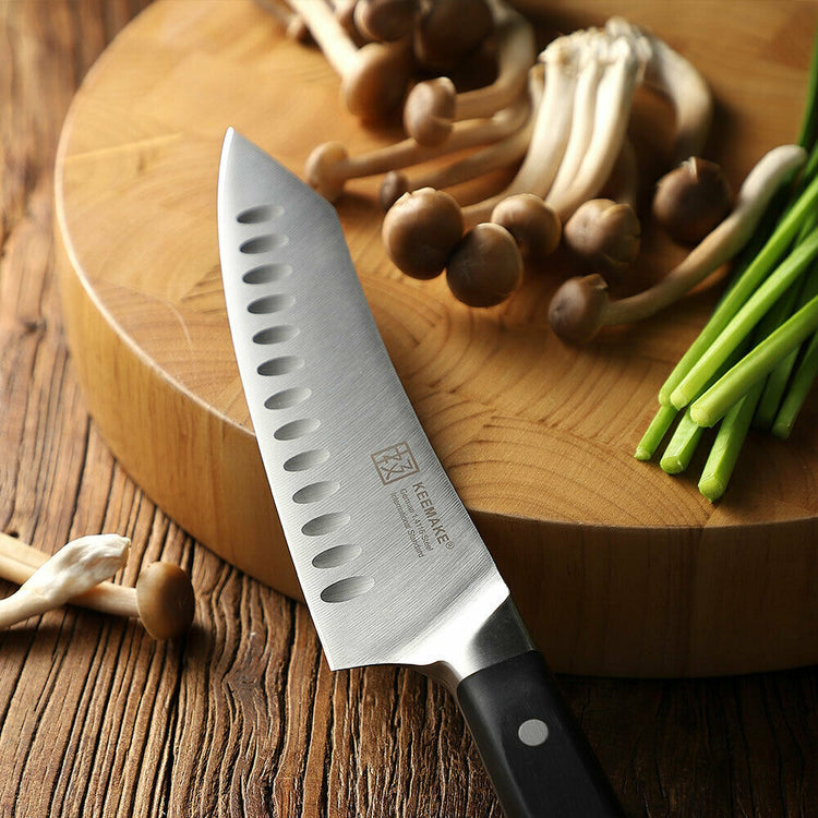 a knife on a cutting board next to mushrooms