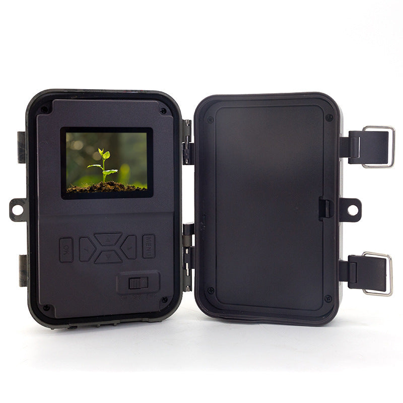 a small black box with a screen and a small plant